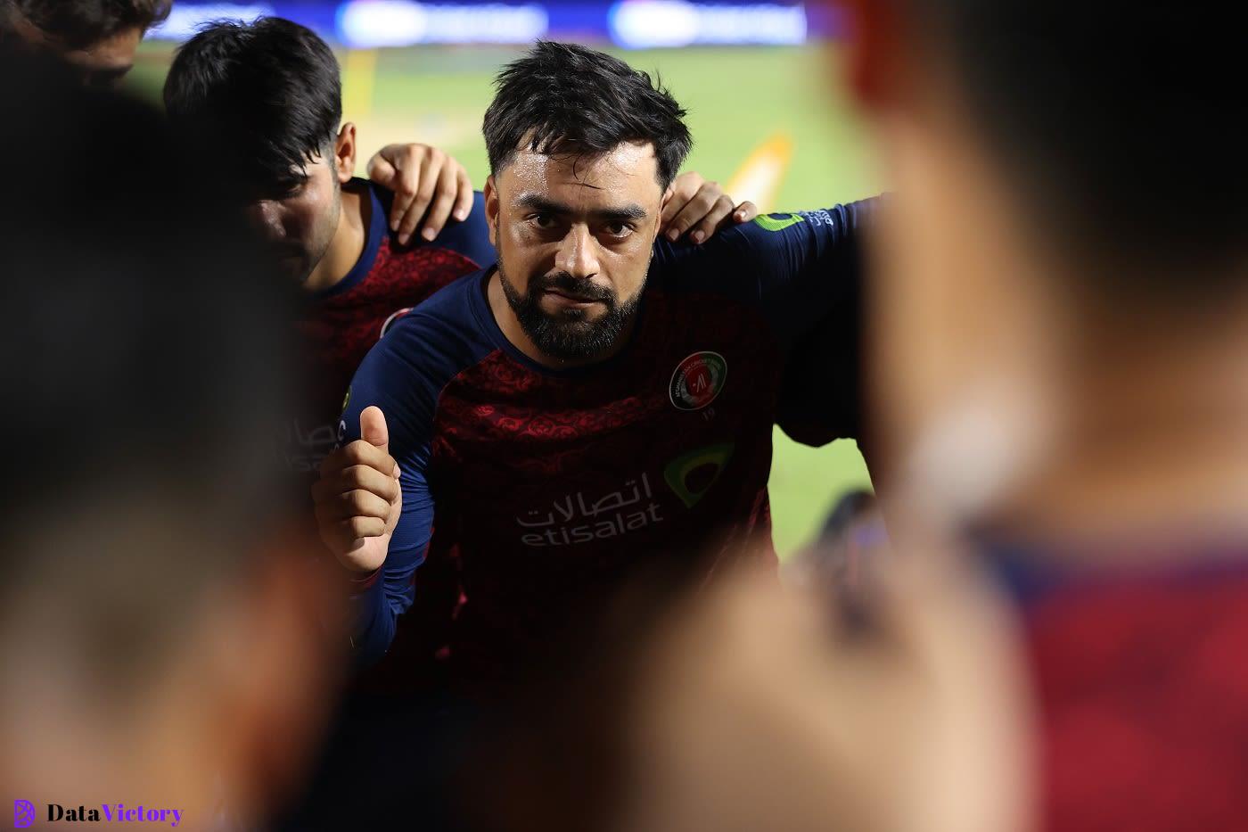 Rashid Khan leads a team huddle, Afghanistan vs PNG, T20 World Cup, Group C, Trinidad, June 13, 2024