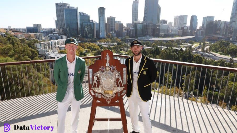 Jordan Silk and Sam Whiteman pose with the Sheffield Shield trophy at King's Park in Perth