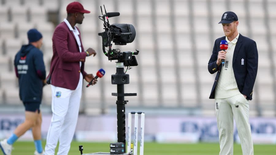 Ben Stokes and Jason Holder hold microphones as they talk into a remote television broadcast camera, first day, first Test, England v West Indies, Ageas Bowl, Southampton, July 8, 2020