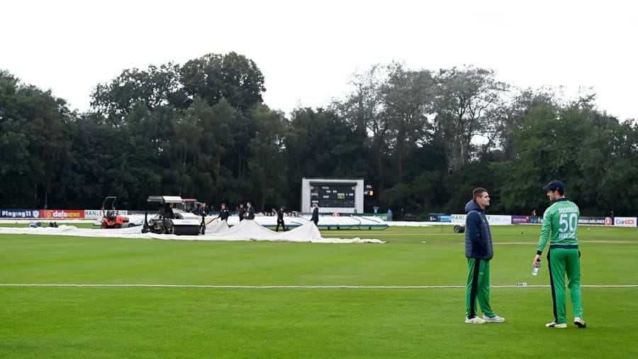 Josh Little and George Dockrell have a chat while the ground staff works during a rain break, Ireland vs Zimbabwe, 2nd ODI, Belfast, September 10, 2021