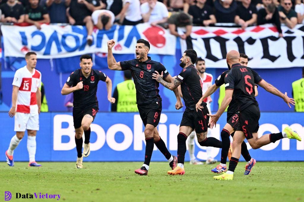 Klaus Gjasula of Albania celebrates scoring his team's second goal with teammates during the UEFA EURO 2024 group stage match between Croatia and Albania at Volksparkstadion on June 19, 2024 in Hamburg, Germany. (Photo by Dan Mullan/Getty Images)