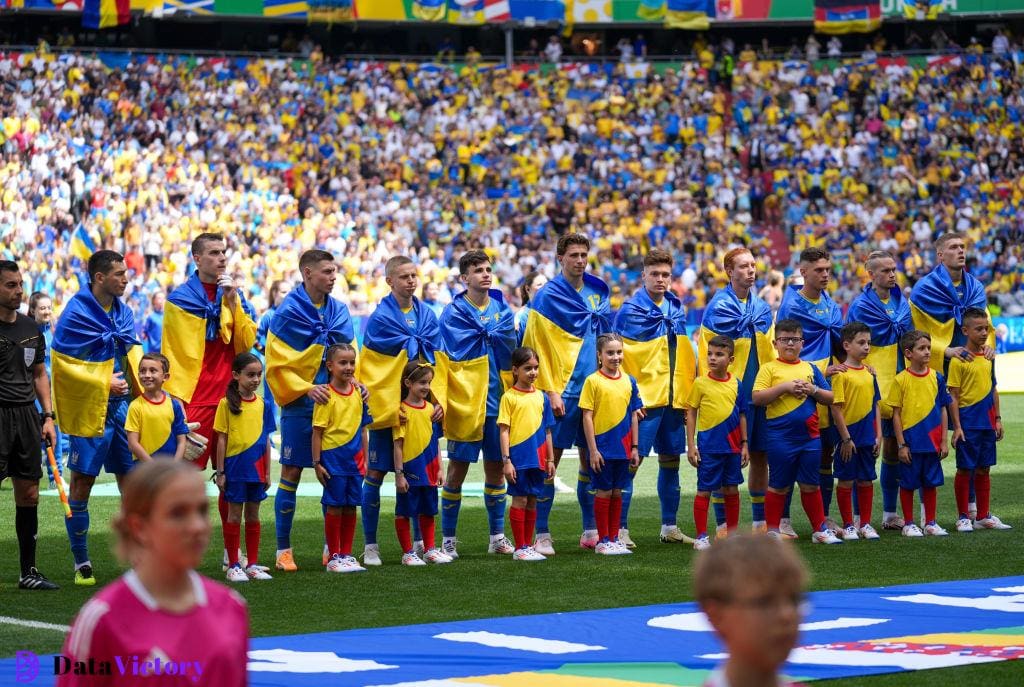 Why do Ukrainian national anthem athletes clatter their flags around their shoulders during Euro 2024?