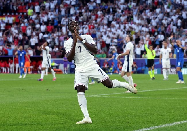 Bukayo Saka of England reacts after scoring a goal as it is disallowed following an offside decision during the UEFA EURO 2024 group stage match between England and Slovenia at Cologne Stadium on June 25, 2024 in Cologne, Germany. (Photo by Alex Grimm/Getty Images)