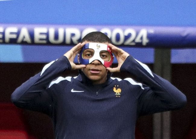 Kylian Mbappe wearing a protective mask after breaking his nose at Euro 2024