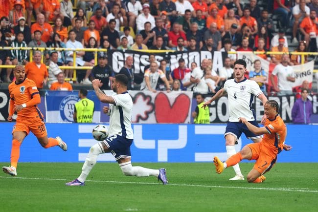 Xavi Simons of the Netherlands scores the first goal during the UEFA EURO 2024 semi-final match between Netherlands and England at Football Stadium Dortmund on July 10, 2024 in Dortmund, Germany. (Photo by Chris Brunskill/Fantasista/Getty Images)