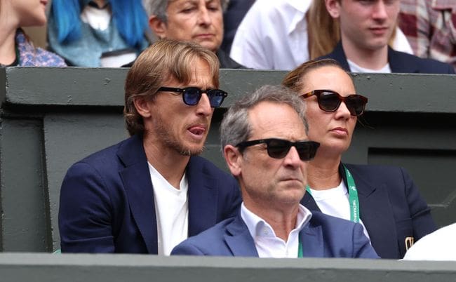 Luka Modric looks on from Carlos Alcaraz's player's box during the Gentlemen's Singles Semi-Final match between Carlos Alcaraz of Spain and Daniil Medvedev during day twelve of The Championships Wimbledon 2024 at All England Lawn Tennis and Croquet Club on July 12, 2024 in London, England