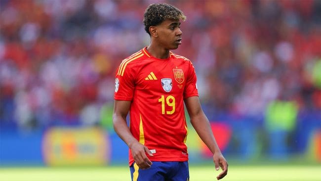 Spain's Lamine Yamal walking across the pitch during his side's Euro 2024 win against Croatia.