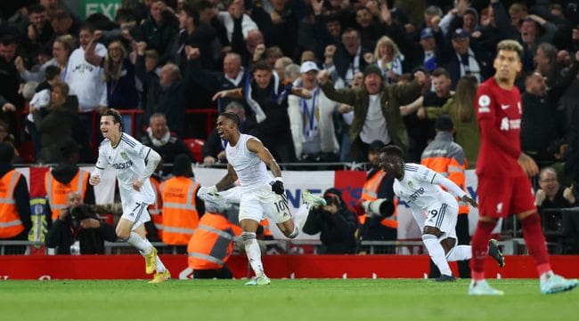 Crysencio Summerville celebrates his late winner against Liverpool at Anfield in 2022