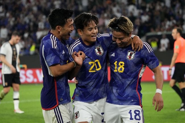 Takuma Asano (R) of Japan celebrates with teammates after scoring the team's third goal with teammate Takefusa Kubo (C) and Wataru Endo during the international friendly match between Germany and Japan at Volkswagen Arena on September 09, 2023 in Wolfsburg, Germany. (Photo by Koji Watanabe/Getty Images) Liverpool