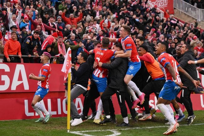 Cristhian Stuani of Girona FC celebrates with teammates after scoring the team's second goal during the LaLiga EA Sports match between Girona FC and Valencia CF at Montilivi Stadium on December 02, 2023 in Girona, Spain.