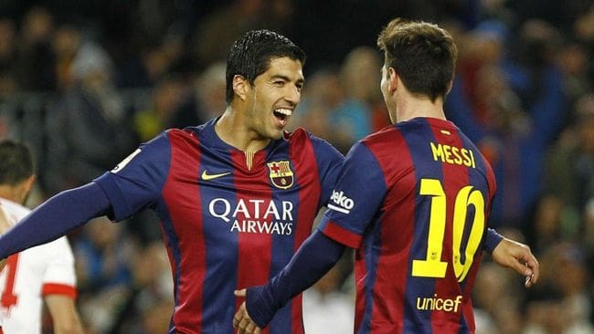 Luis Suarez and Lionel Messi celebrate together