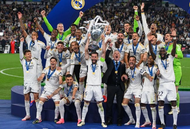 Real Madrid celebrate with the trophy after winning the 2024 UEFA Champions League final