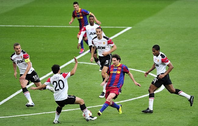 Barcelona's Lionel Messi (2nd R) vies with the Manchester United defence during the UEFA Champions League final football match on May 28, 2011 at Wembley stadium in London. AFP PHOTO / GLYN KIRK (Photo credit should read GLYN KIRK/AFP via Getty Images)