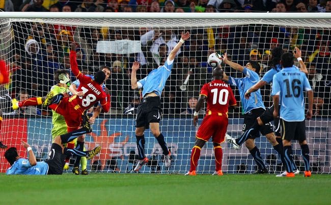 JOHANNESBURG, SOUTH AFRICA - JULY 02: Luis Suarez of Uruguay handles the ball on the goal line, for which he is sent off, during the 2010 FIFA World Cup South Africa Quarter Final match between Uruguay and Ghana at the Soccer City stadium on July 2, 2010 in Johannesburg, South Africa. (Photo by Michael Steele/Getty Images)