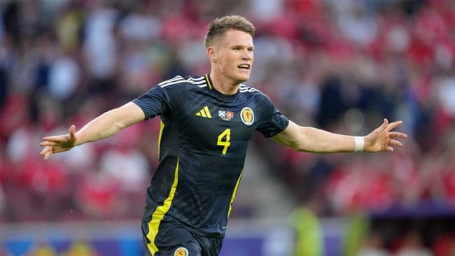 Scott McTominay celebrates scoring his side's goal against Switzerland at Euro 2024.