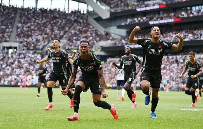 Gabriel of Arsenal celebrates scoring his team's first goal during the Premier League match between Tottenham Hotspur FC and Arsenal FC at Tottenham Hotspur Stadium on September 15, 2024 in London, England