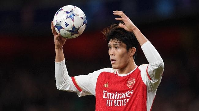 Takehiro Tomiyasu in action for Arsenal in the Champions League against Sevilla in November 2023.